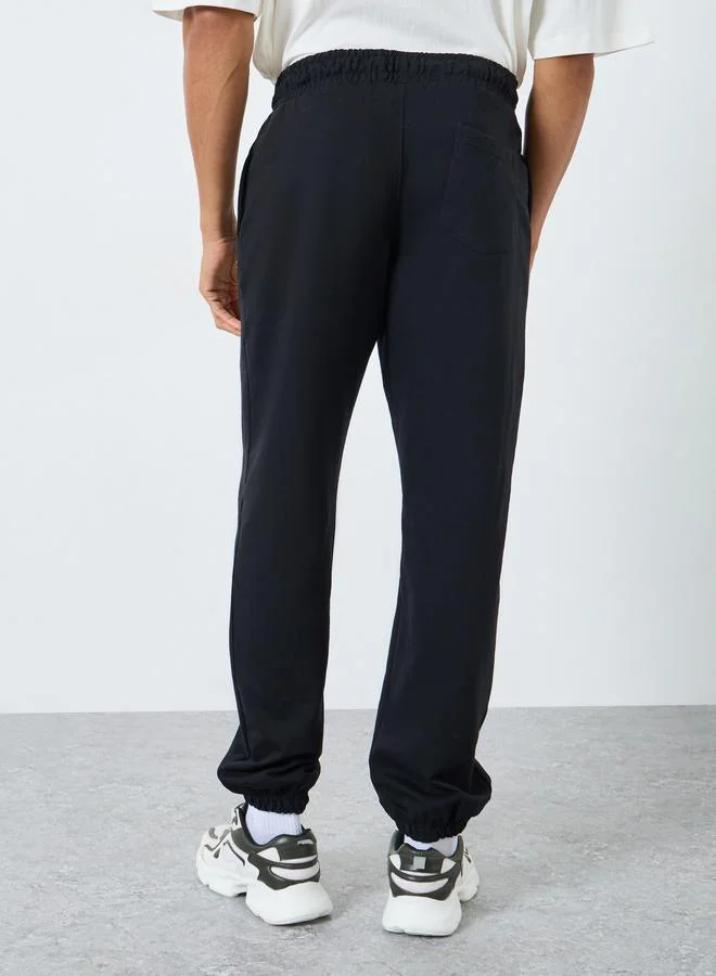 Styli Men Black Solid Fleece Oversized Joggers